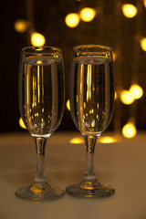 Two glasses of pink champagne for the couple.
