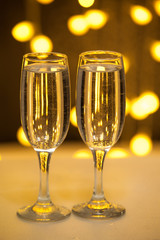 Two glasses of pink champagne for the couple.