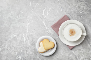 Flat lay composition with coffee on grey marble table, space for text. Tasty breakfast