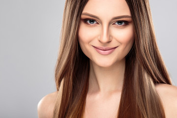 Fototapeta premium Young woman with beautiful healthy long hair and natural make up. Fashion beauty portrait