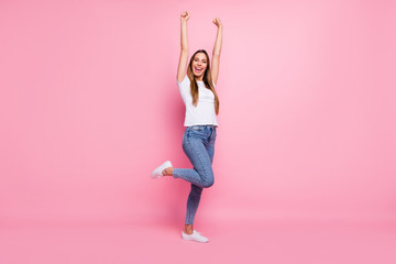 Full length photo of nice lady celebrating mood raise hands fists crazy cheerleader screaming support words wear casual white t-shirt jeans isolated pink color background