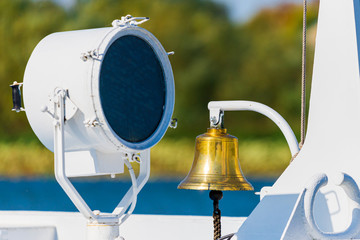 Naklejka na ściany i meble Ship's bell and signal light on the ship
