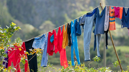 cuban clothes line with colorful clothes, red, blue,  cuba
