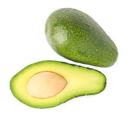 Tasty ripe avocados on white background, top view. Tropical fruit