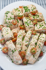 Salmon fillet seasoned with cherry tomato