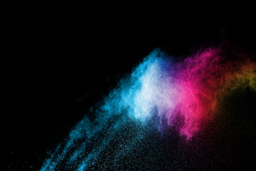 Explosion of colored powder isolated on black background. Abstract colored background. holi festival.