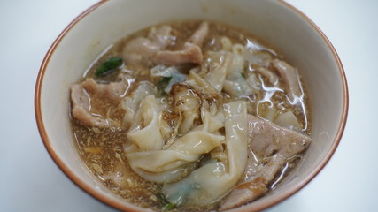 noodles in gravy pork, fried eggs and vegetables