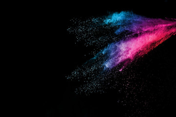 Explosion of colored powder isolated on black background. Abstract colored background. holi festival.