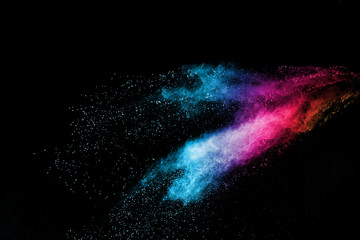 Explosion of colored powder isolated on black background. Abstract colored background. holi festival.
