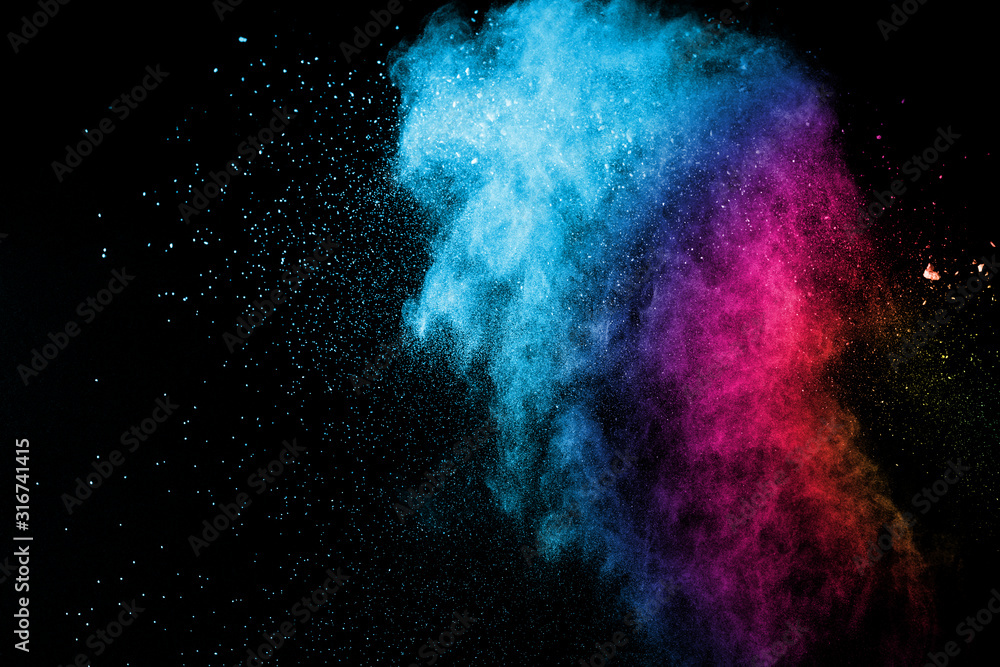 Wall mural explosion of colored powder isolated on black background. abstract colored background. holi festival