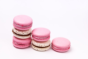 Stack of Pink and White Macarons on White Background French Dessert Caramel and Strawberry Macarons Horizontal