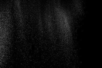Freeze motion of white color powder exploding on dark background. 