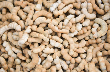 Pile of sweet tamarind for sale in the market fruit - fresh tamarind texture background