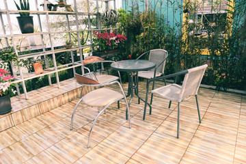 Home gardening and decorating indoor microgreen greenhouse environments secret gardens and modern gardening setups flowers and ornamental plants gardening and greenery in workspaces table and chairs