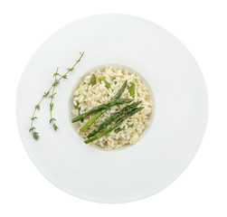 Delicious risotto with asparagus isolated on white, top view