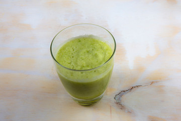 A glass of pineapple and apple juice