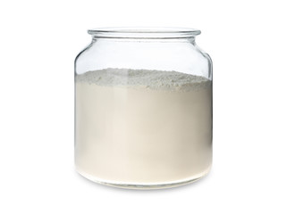 Organic flour in glass jar isolated on white