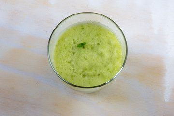 A glass of pineapple and apple juice