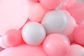 Beautiful colorful balloons on light background, closeup