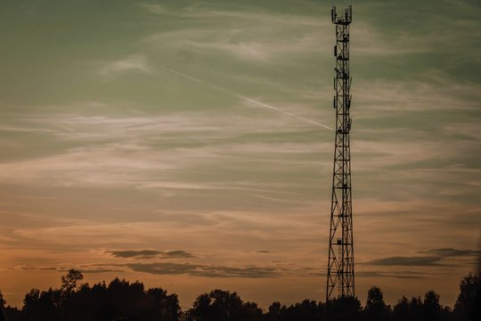 electrical tower at sunset © юлия Купавцева