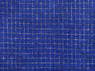 Fabric of blue check lurex with coarse thread.