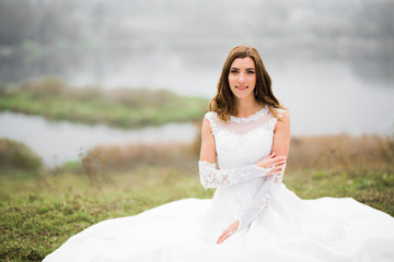 Beautiful fashion bride in wedding dress posing