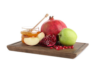 Honey, apples and pomegranate on white background. Rosh Hashanah holiday