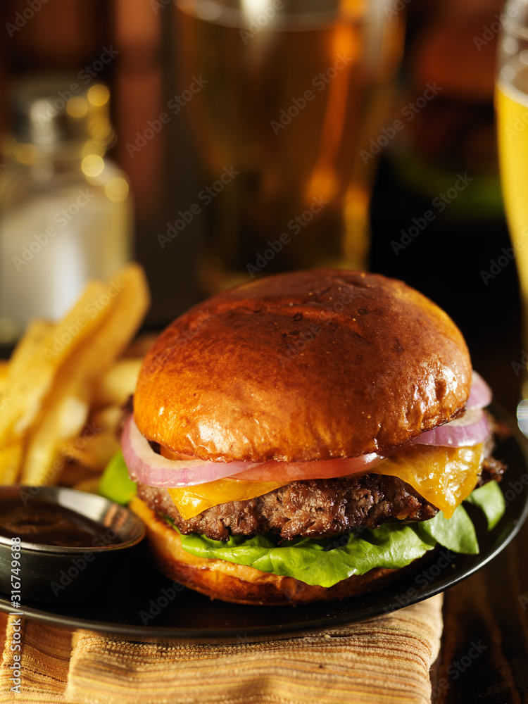 Wall mural dimly lit cheeseburger in warm light