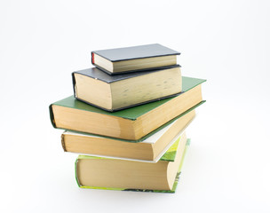A stack of different books on a white background.