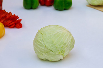Head of fresh cabbage for salad on a white background.