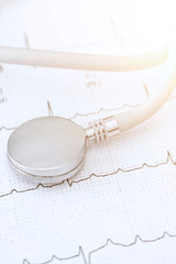 Stethoscope on electrocardiograph wirh medical concept