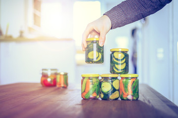 Variety of tasty vegetables in preserving glasses. Conservation of food.