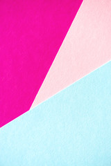 Fototapeta premium Lilac, soft pastel blue and light pink colored textured paper for the background. Geometric empty paper background of three tones for copy space.
