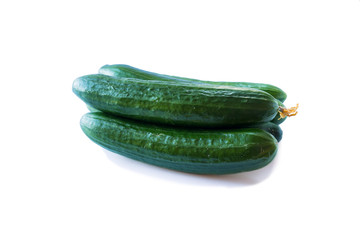 Fresh cucumbers isolated on white background. Design element for product label. Design image of fresh whole cucumbers. Cucumbers with copy space for text.