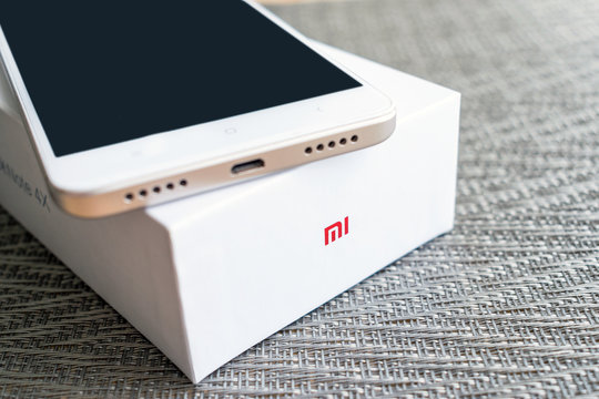 KIEV, UKRAINE - MAY 28, 2018: Xiaomi Redmi Note 4x gold white smartphone with box developed by Xiaomi Inc. Xiaomi is privately owned Chinese electronic company.