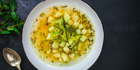 soup broccoli, broth and other vegetables (vegetarian first course) menu concept. background. top view. copy space