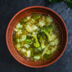 soup broccoli, broth and other vegetables (vegetarian first course) menu concept. background. top view. copy space