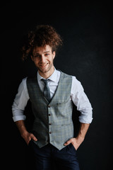 Obraz premium Attractive bearded young man in classic vest and tie. Elegancy a