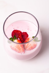 strawberry in glass on white background