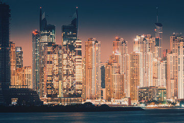 Fototapeta premium Night cityscape view of various skyscrapers. Real Estate and residential building concept