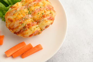 sausage bread roll in white dish