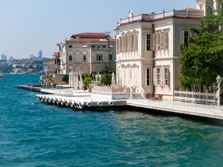 Mansions along the Bosporus Strait in Turkey a  bright summer day. View from cruise ship.