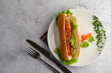 Appetizing of hotdog placed in white dish beautifully