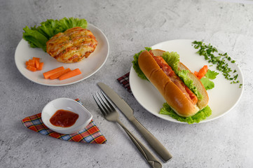 Appetizers with sausage bread roll and hotdog