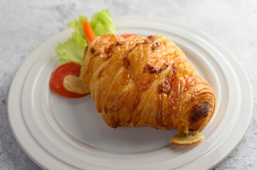 Appetizers the Croissant with hotdog on white dish