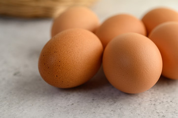 Close up Organic brown eggs several on the floor