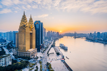 Dusk view of golden high-rise buildings along the Yangtze River in Chongqing, China