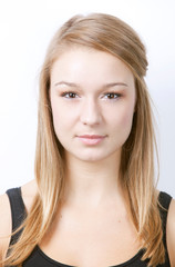 Portrait of beautiful young woman against white background