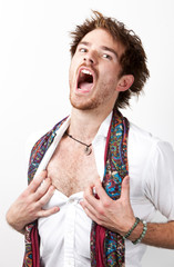 Portrait of humorous young man screaming against white background