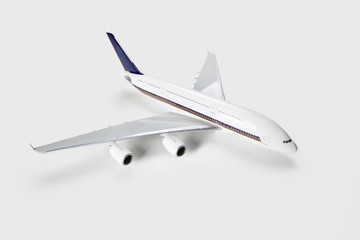 Model airplane over white background